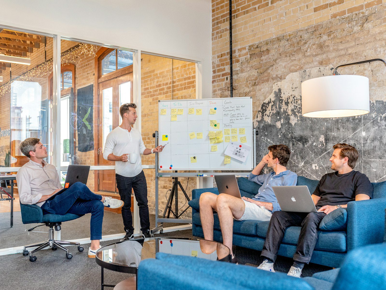 Team working through strategy at a whiteboard